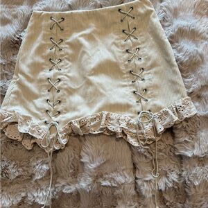 Lace-Up Cream Mini Skirt with Ruffle Hem